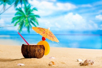 Coconut with umbrella on the beach
